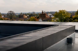 Modern flat roof surface and waterproof roof edge detail